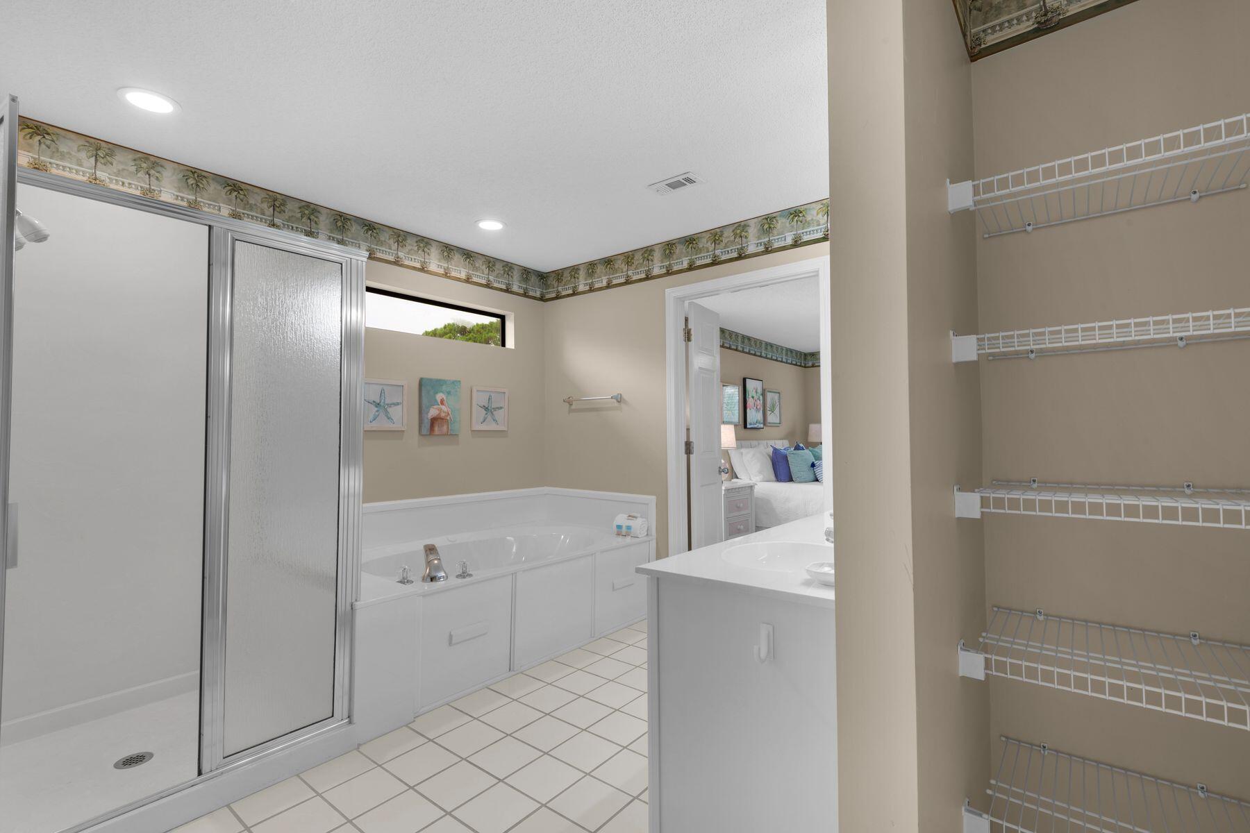 77 Golf Tee Lane, Unit 27G Miramar Beach, FL 32550 - Photo 15 of 29 a bathroom with a shower and a mirror