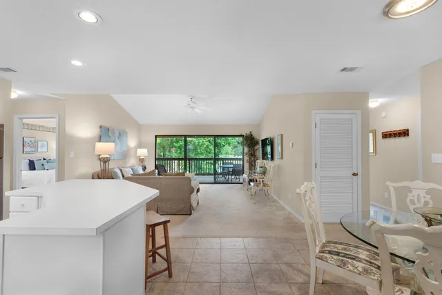 a large kitchen with a table and chairs in it
