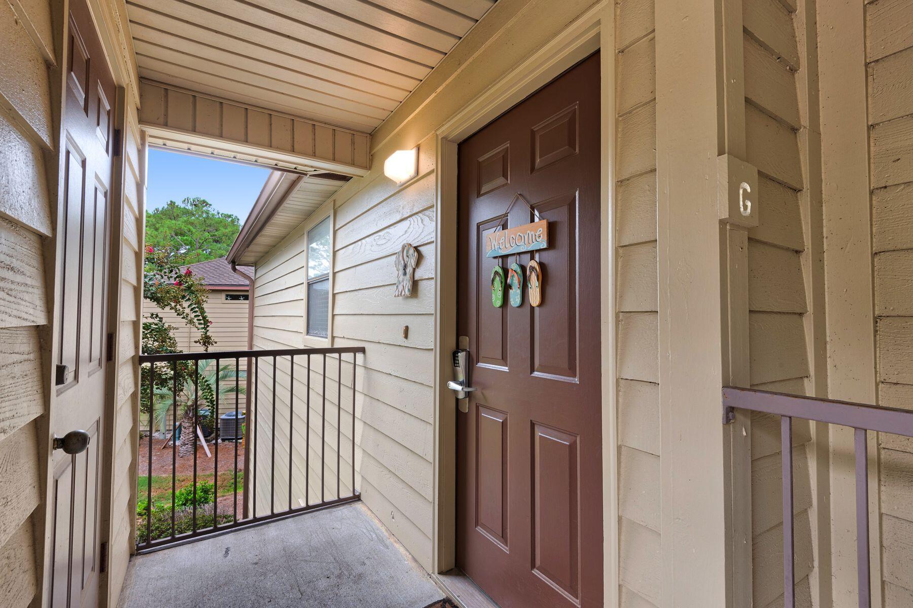 77 Golf Tee Lane, Unit 27G Miramar Beach, FL 32550 - Photo 26 of 29 a view of a house with a glass door