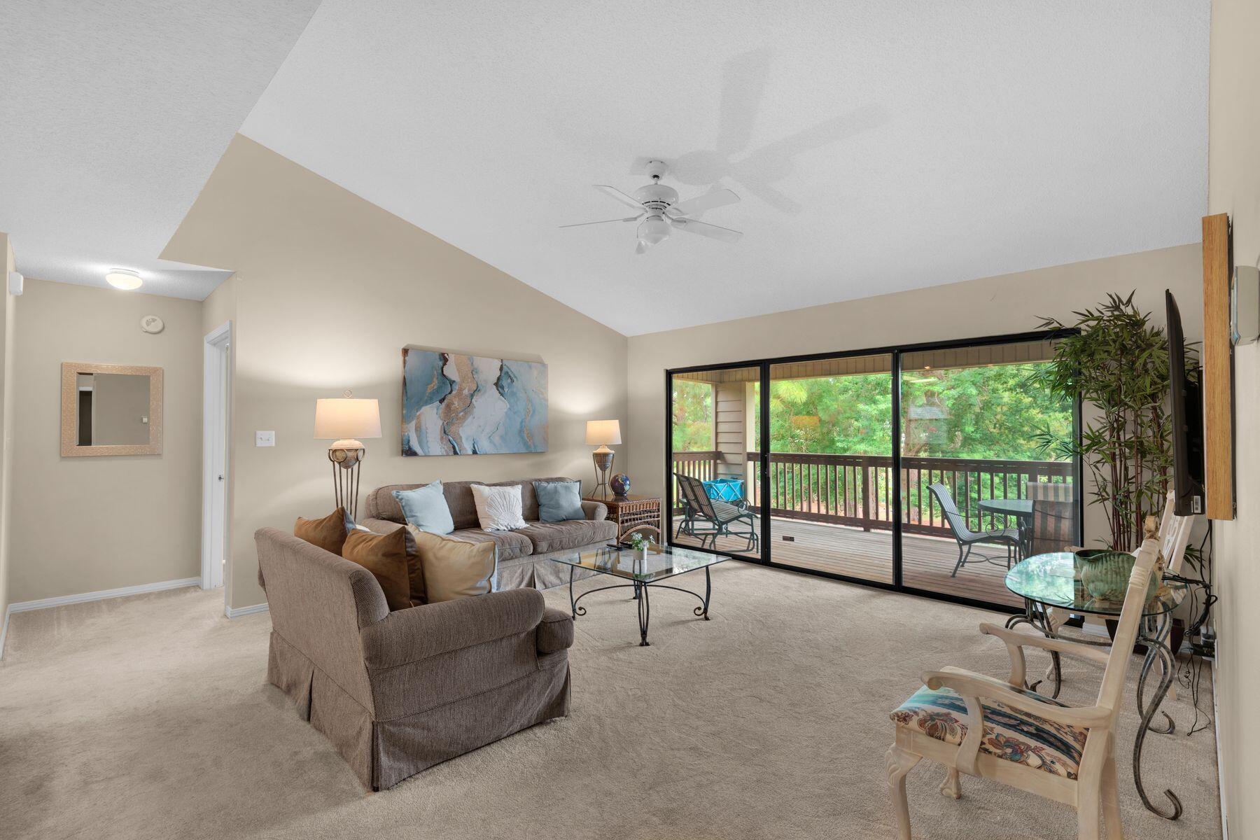 77 Golf Tee Lane, Unit 27G Miramar Beach, FL 32550 - Photo 6 of 29 a living room with furniture and a large window with outer view