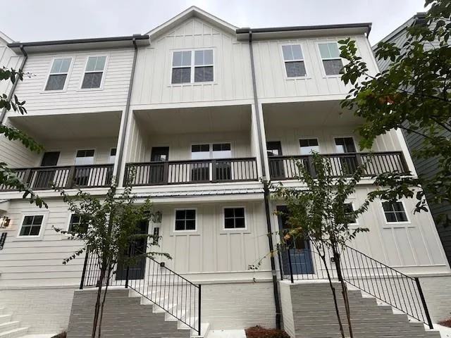 a view of a house with more windows and wooden floor