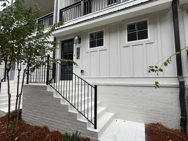 a kitchen with a sink and wooden floor