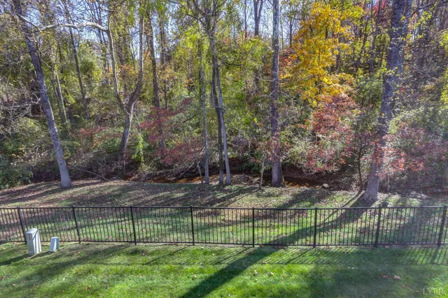 a view of a yard with a street from a house