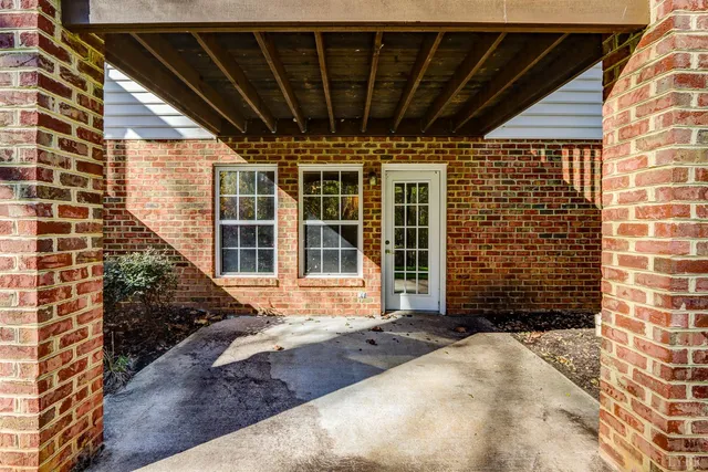a view of a porch with wooden floor and stairs