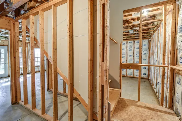 a room with lots of furniture and a chandelier