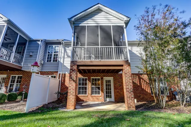 a view of a yard with flower plants