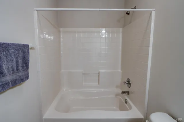 a view of a room with wooden walls