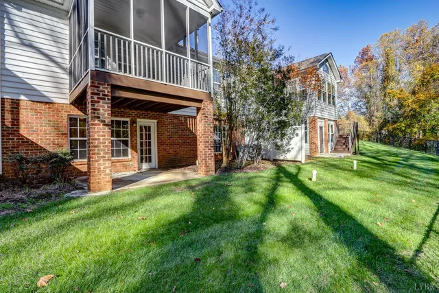a view of a backyard with large trees