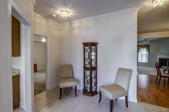 a living room with furniture and a lamp