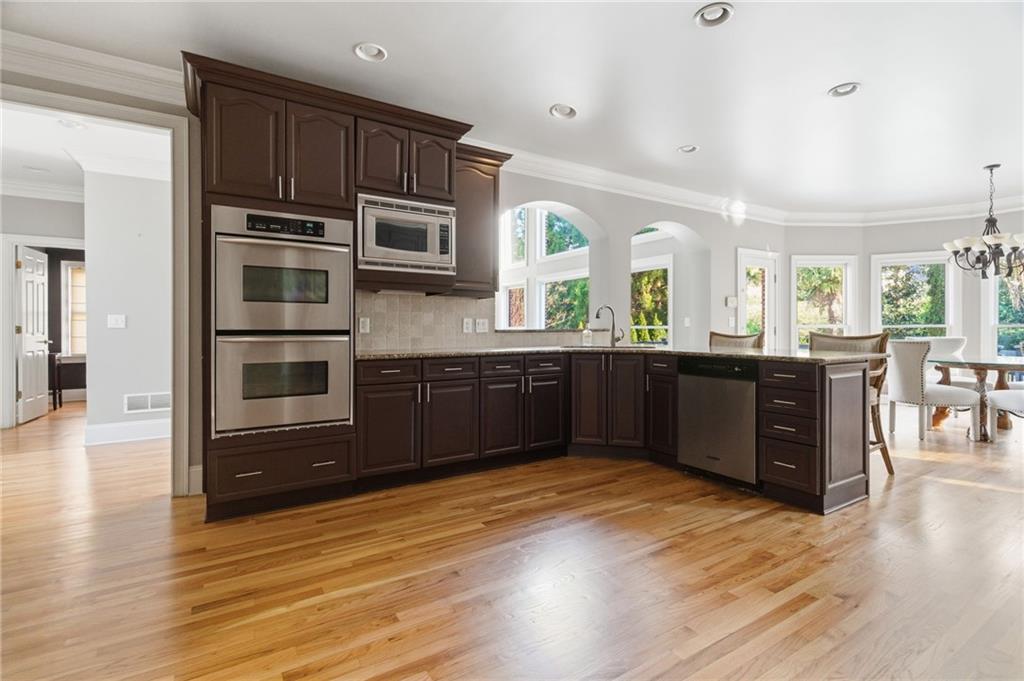 1607 Oak Grove Road Decatur, GA 30033 - Photo 11 of 71 a kitchen with stainless steel appliances granite countertop a stove a sink and a refrigerator