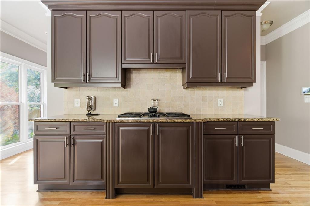 1607 Oak Grove Road Decatur, GA 30033 - Photo 12 of 71 a kitchen with stainless steel appliances granite countertop a stove a sink dishwasher and cabinets with wooden floor
