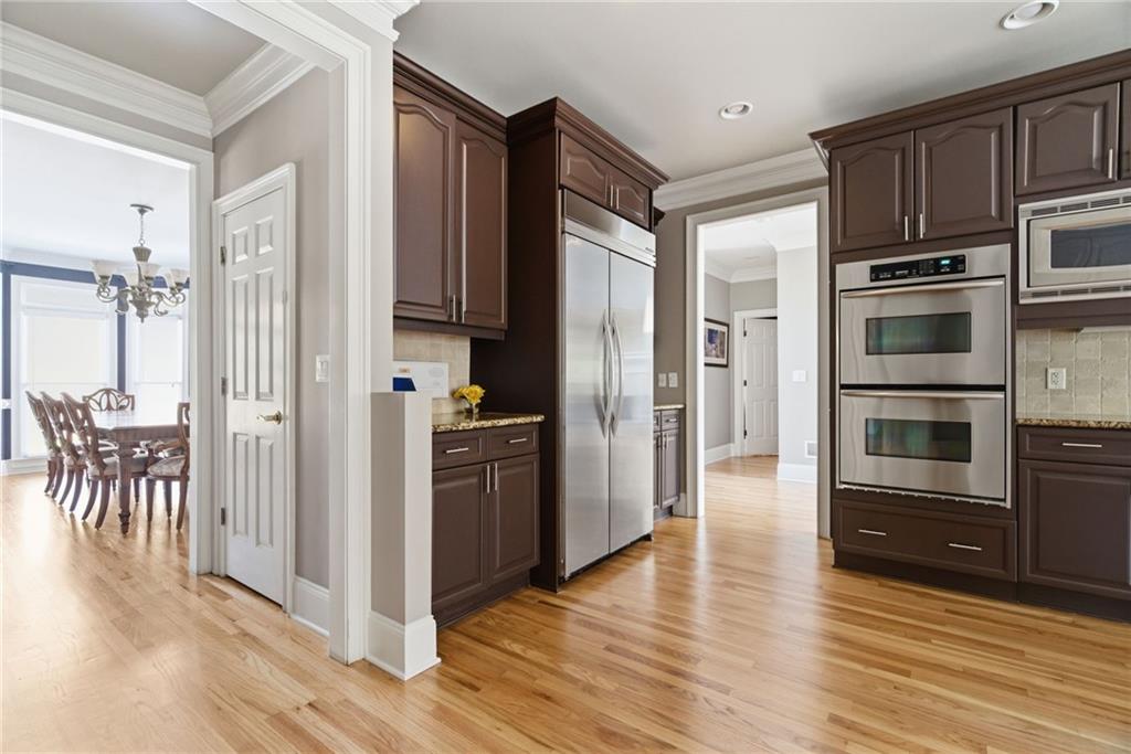 1607 Oak Grove Road Decatur, GA 30033 - Photo 13 of 71 a kitchen with stainless steel appliances a refrigerator and a stove top oven