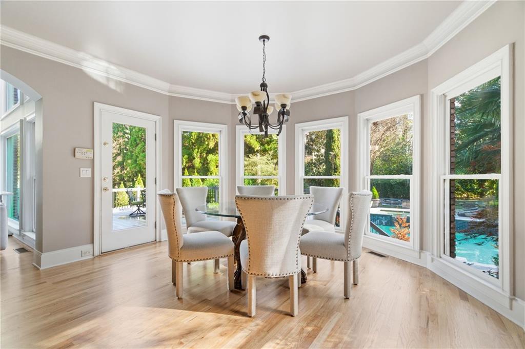 1607 Oak Grove Road Decatur, GA 30033 - Photo 17 of 71 a living room with furniture and a chandelier
