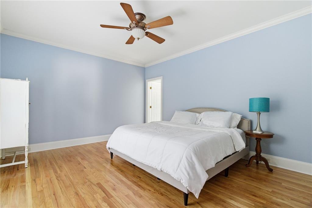 1607 Oak Grove Road Decatur, GA 30033 - Photo 18 of 71 a bedroom with a bed and a chandelier