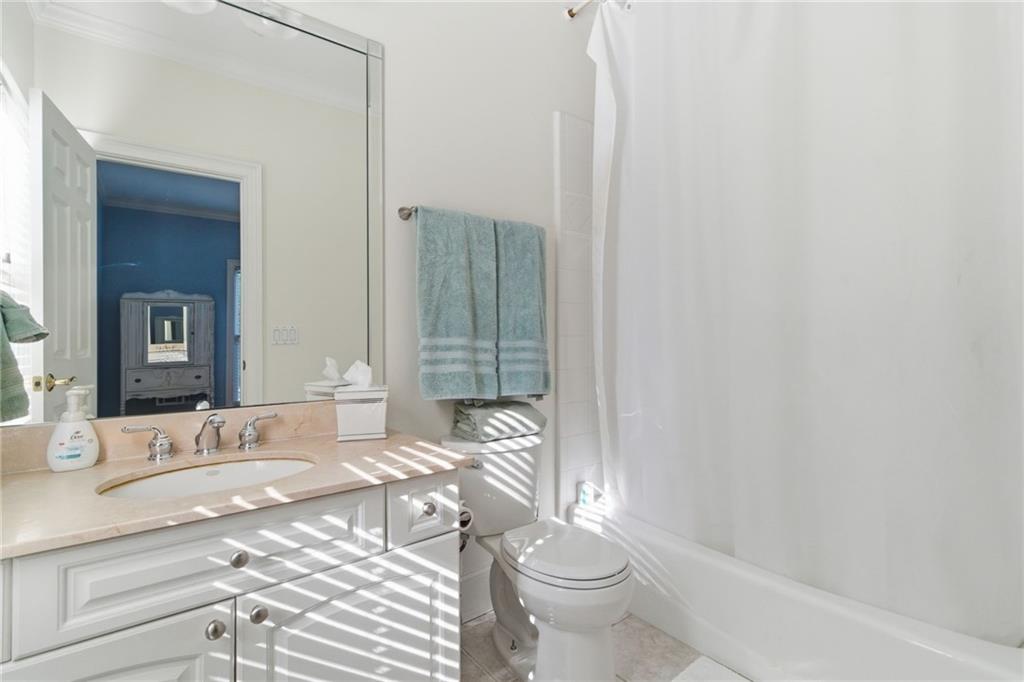 1607 Oak Grove Road Decatur, GA 30033 - Photo 19 of 71 a bathroom with a granite countertop sink mirror vanity and toilet