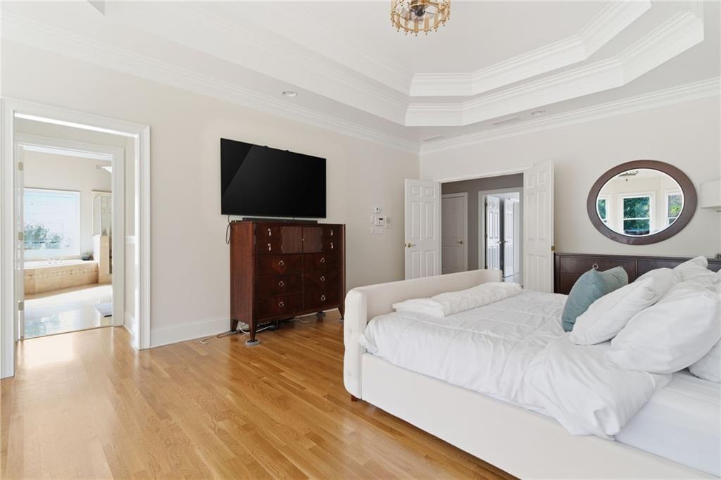 1607 Oak Grove Road Decatur, GA 30033 - Photo 21 of 71 a bedroom with a bed and a flat screen tv