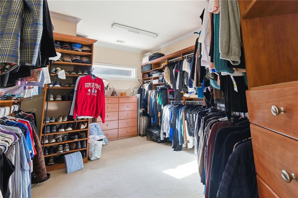 1607 Oak Grove Road Decatur, GA 30033 - Photo 26 of 71 a view of walk in closet with clothes and shoes