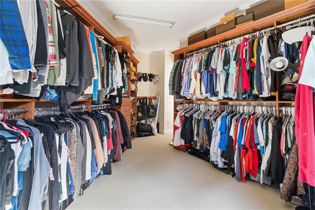 1607 Oak Grove Road Decatur, GA 30033 - Photo 27 of 71 a view of walk in closet with clothes