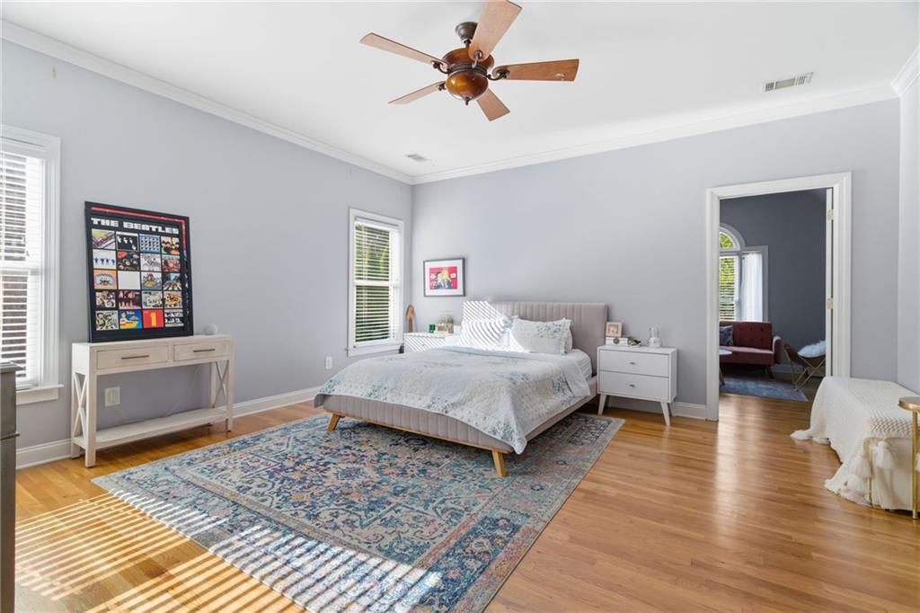 1607 Oak Grove Road Decatur, GA 30033 - Photo 30 of 71 a bedroom with a bed and wooden floor