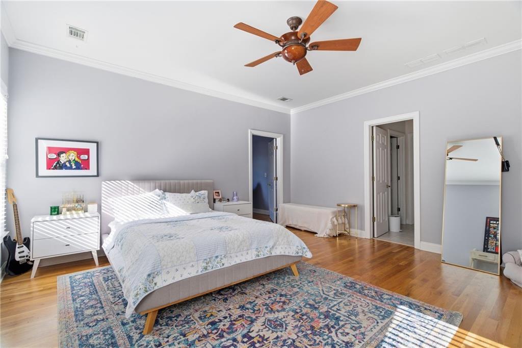 1607 Oak Grove Road Decatur, GA 30033 - Photo 31 of 71 a bedroom with a bed and a chandelier