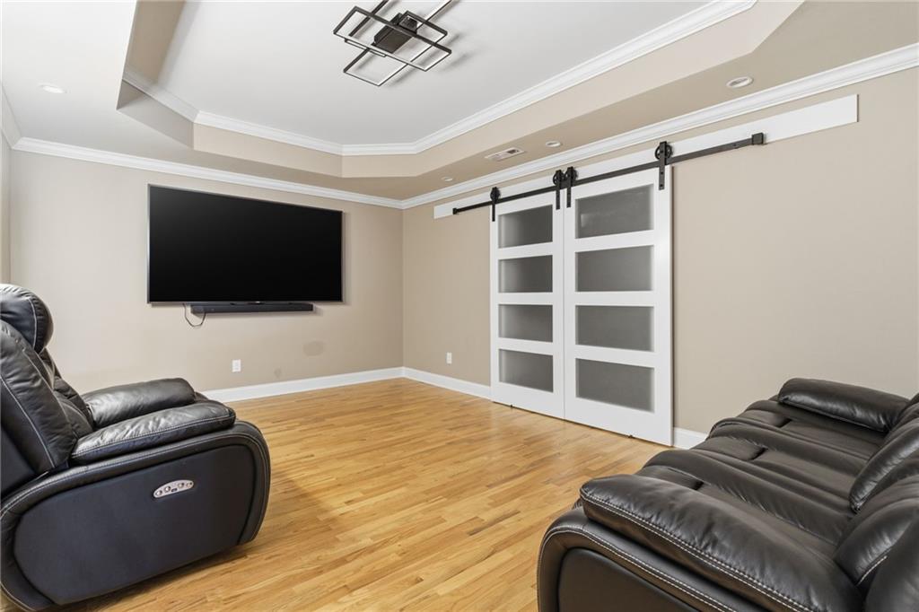 1607 Oak Grove Road Decatur, GA 30033 - Photo 36 of 71 a living room with a flat screen tv a couch and a flat screen tv