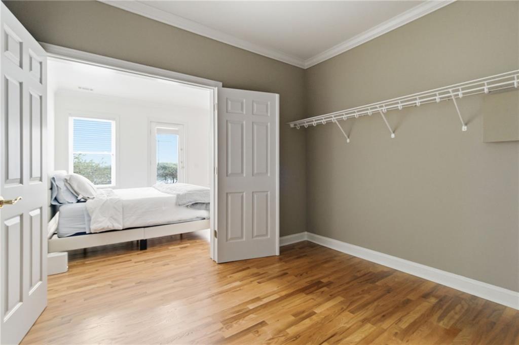 1607 Oak Grove Road Decatur, GA 30033 - Photo 43 of 71 a bedroom with a bed and a walk in closet