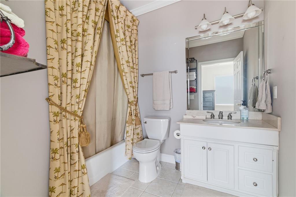 1607 Oak Grove Road Decatur, GA 30033 - Photo 45 of 71 a bathroom with a sink a toilet and shower curtain
