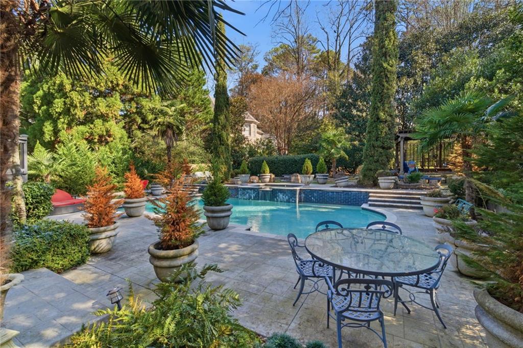 1607 Oak Grove Road Decatur, GA 30033 - Photo 52 of 71 a backyard of a house with table and chairs