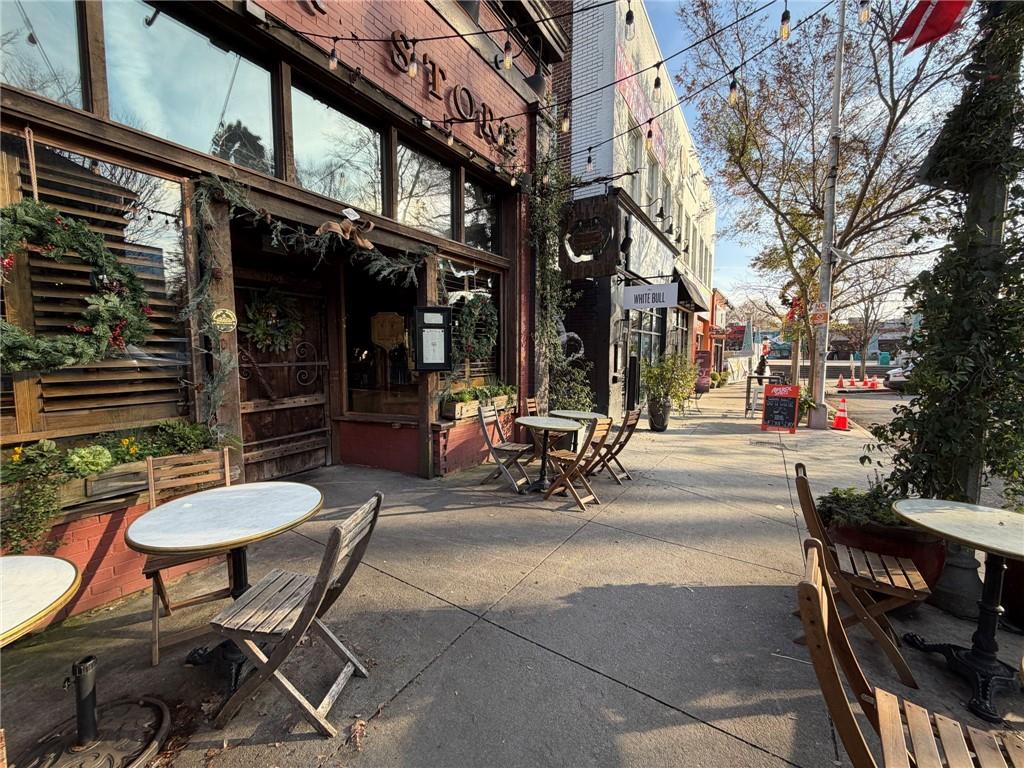 1607 Oak Grove Road Decatur, GA 30033 - Photo 69 of 71 a view of a patio with table and chairs and a barbeque