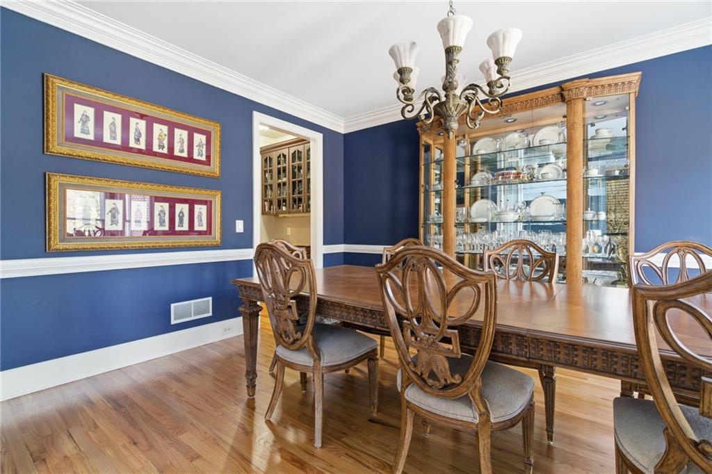 1607 Oak Grove Road Decatur, GA 30033 - Photo 7 of 71 a view of a dining room with furniture wooden floor and chandelier