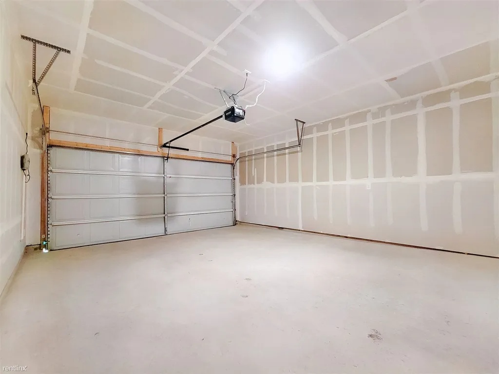 419 Sickle Loop Kyle, TX 78640 - Photo 31 of 35 Ample garage space provides convenience and secure parking for vehicles.