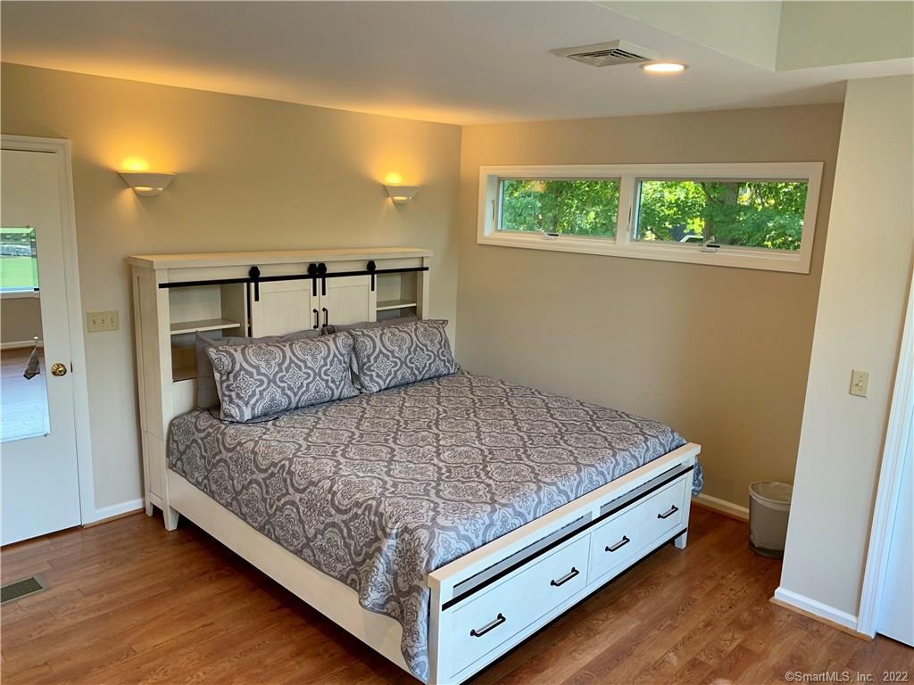 11 Candlewood Road New Fairfield, CT 06812 - Photo 17 of 24 a bed sitting in a bedroom next to a window