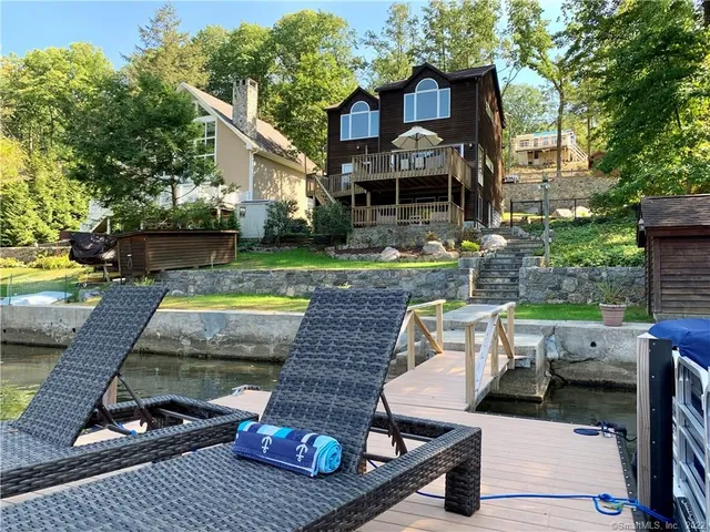 a view of a two chairs in the patio