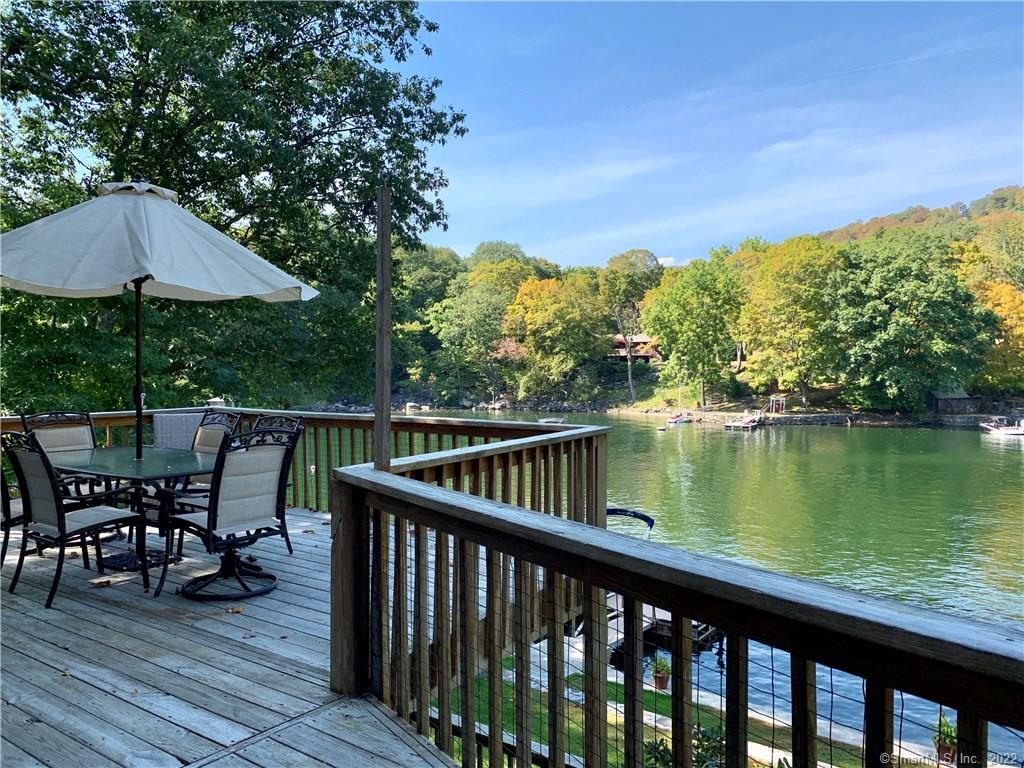 11 Candlewood Road New Fairfield, CT 06812 - Photo 8 of 24 a balcony with wooden floor table and chairs
