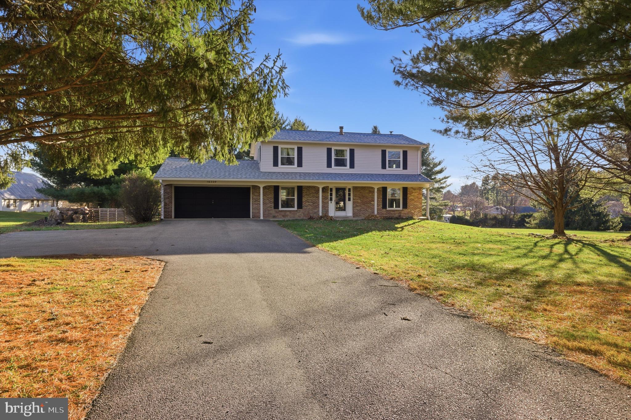 16329 Old Frederick Road Mount Airy, MD 21771 - Photo 3 of 11 a front view of a house with a yard