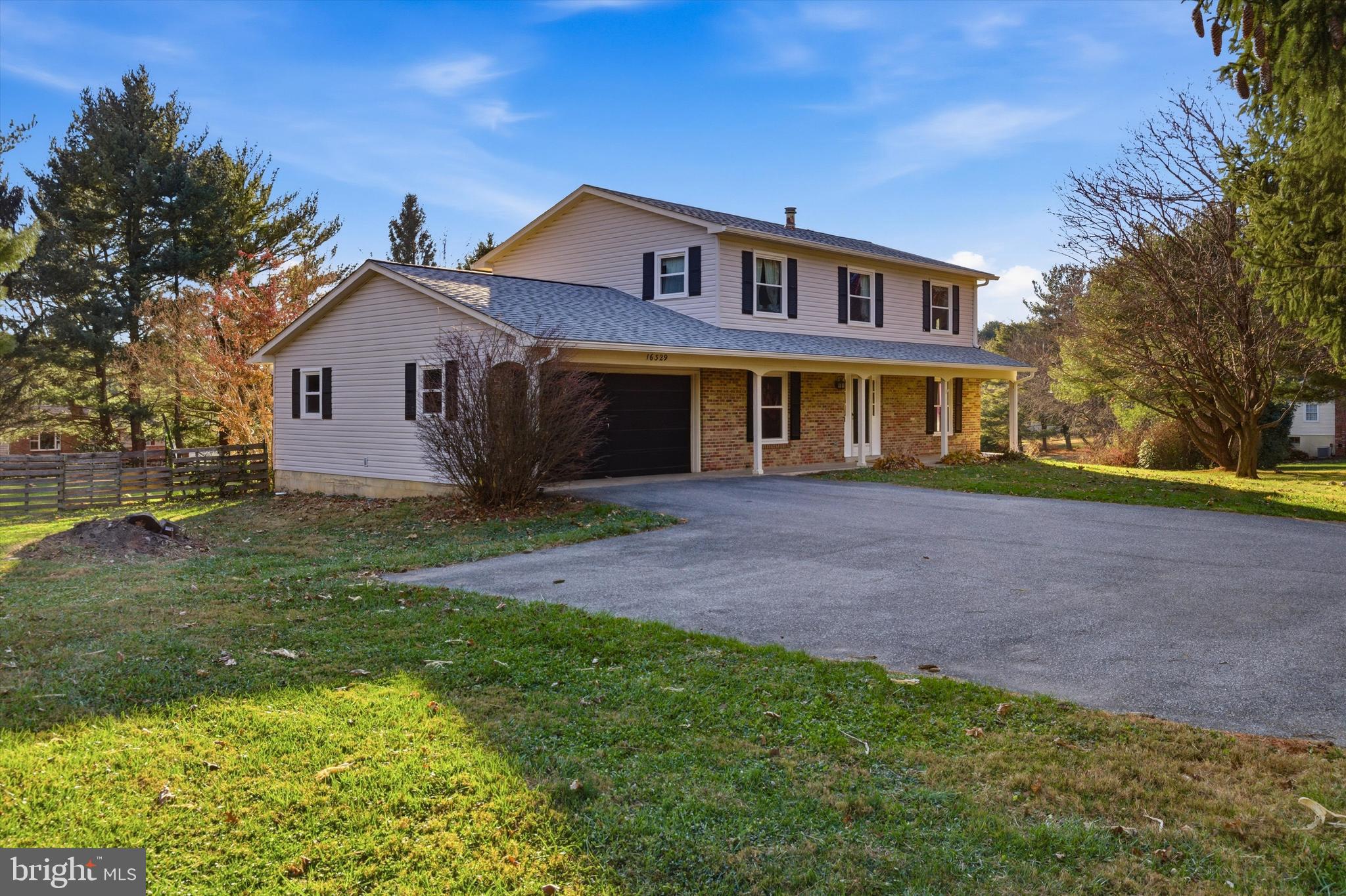 16329 Old Frederick Road Mount Airy, MD 21771 - Photo 5 of 11 a front view of a house with a yard