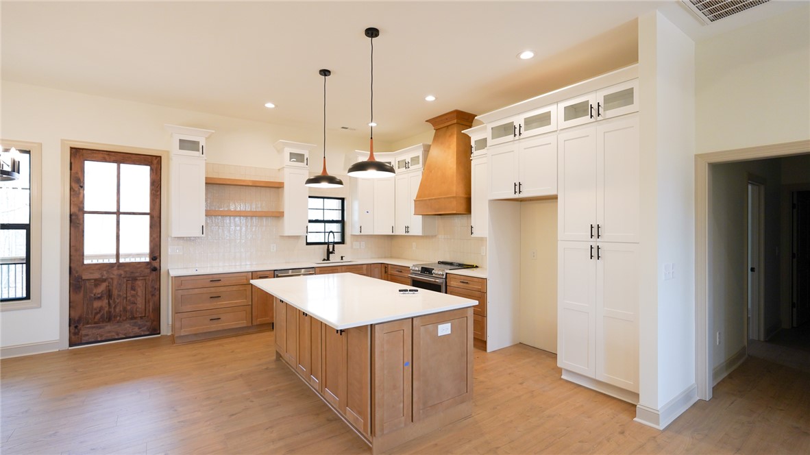 1001 Five Forks Road Pendleton, SC 29670 - Photo 11 of 43 This kitchen features a central island, ample cabinet space, and durable flooring.