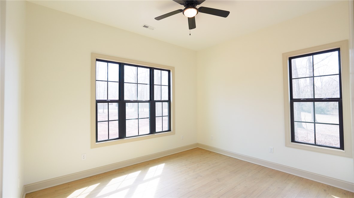 1001 Five Forks Road Pendleton, SC 29670 - Photo 18 of 43 This spacious room features ample natural light and a comforting overhead fan.