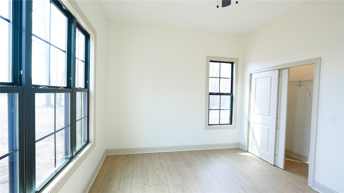 1001 Five Forks Road Pendleton, SC 29670 - Photo 19 of 43 Bright and airy, this room features expansive windows and ample closet space.