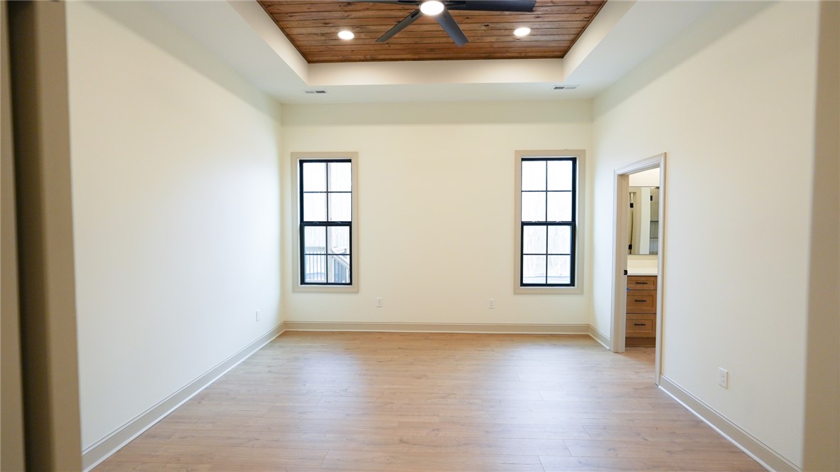 1001 Five Forks Road Pendleton, SC 29670 - Photo 25 of 43 An inviting room features a charming tray ceiling, offering a refined design and bright atmosphere.