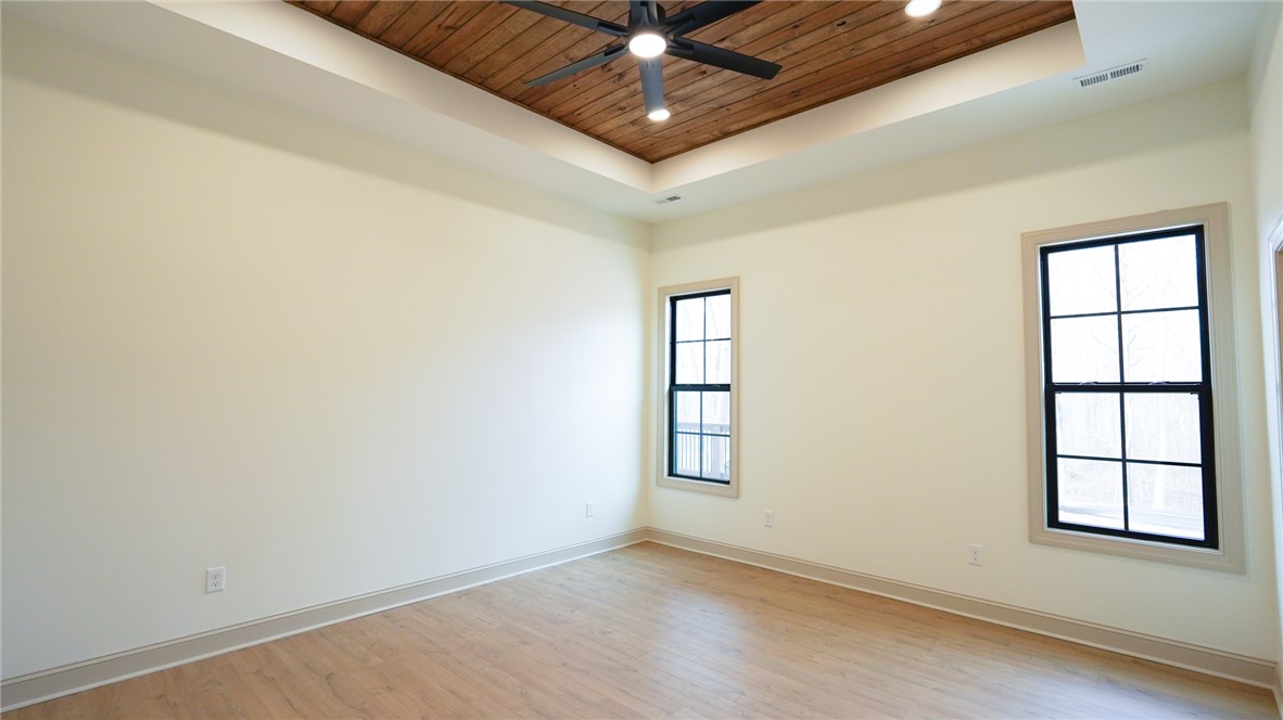 1001 Five Forks Road Pendleton, SC 29670 - Photo 26 of 43 This primary bedroom offers warm wood ceilings and abundant natural light.