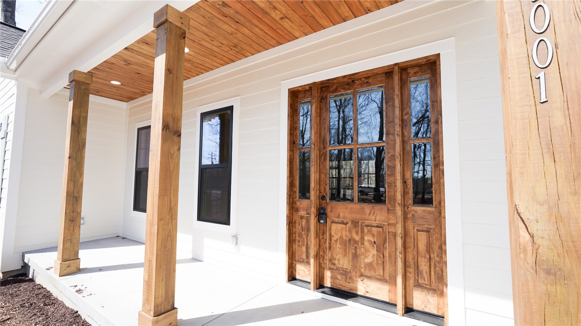 1001 Five Forks Road Pendleton, SC 29670 - Photo 3 of 43 This inviting porch features wood accents and a welcoming front door.
