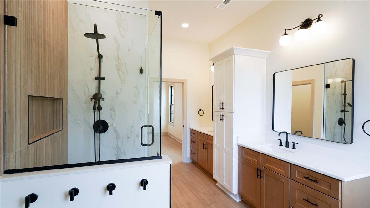 1001 Five Forks Road Pendleton, SC 29670 - Photo 32 of 43 This modern bathroom features a spacious shower and sleek double vanities with ample storage.