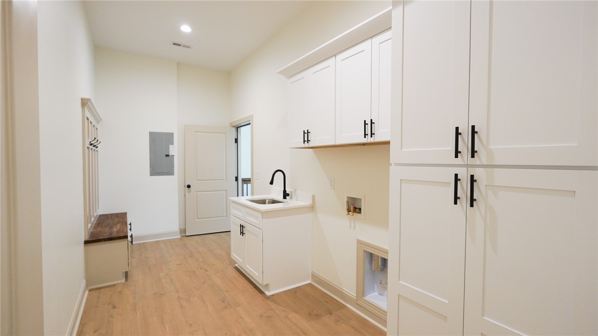 1001 Five Forks Road Pendleton, SC 29670 - Photo 33 of 43 This spacious utility room offers ample storage and a dedicated laundry area.