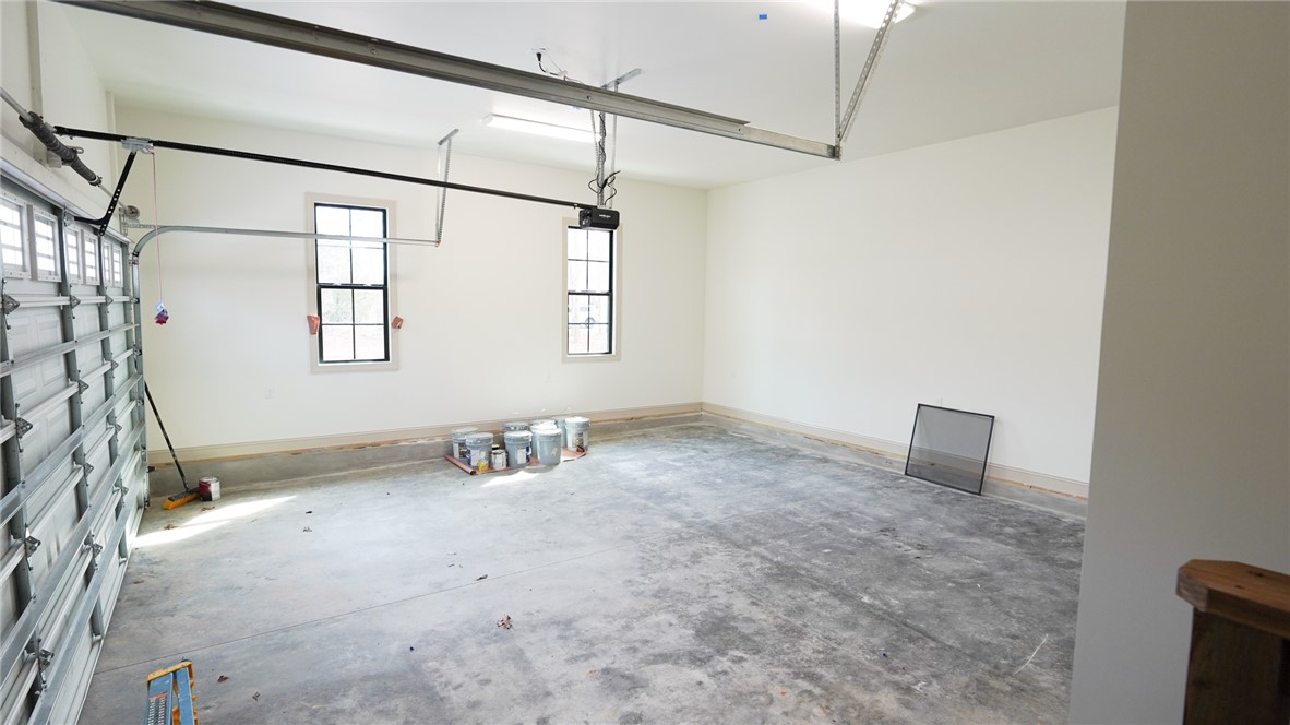 1001 Five Forks Road Pendleton, SC 29670 - Photo 35 of 43 This spacious garage offers ample room and natural light, perfect for storage or a workshop.