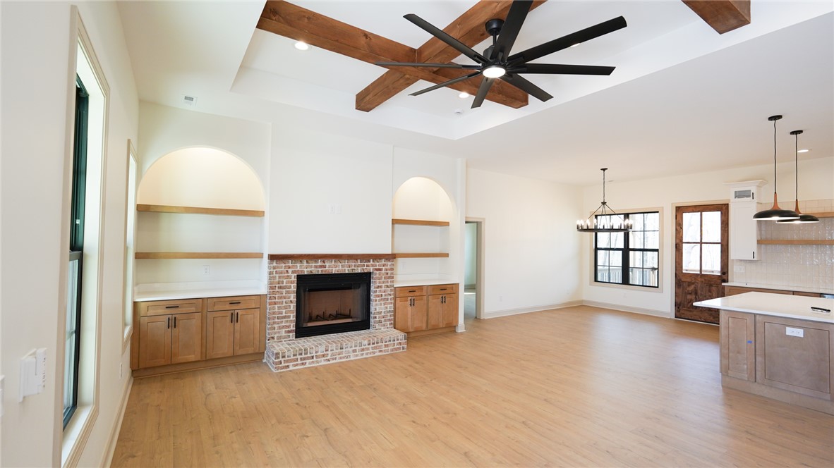 1001 Five Forks Road Pendleton, SC 29670 - Photo 5 of 43 An inviting open-concept living area features a charming fireplace and bright, airy design.