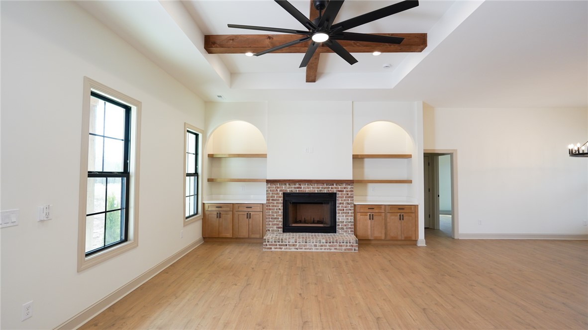1001 Five Forks Road Pendleton, SC 29670 - Photo 6 of 43 This airy living space features a cozy fireplace and built-in shelving, perfect for comfortable gatherings.