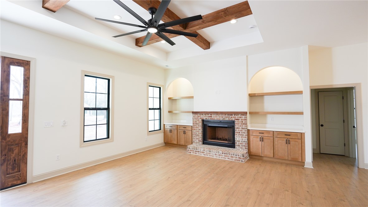 1001 Five Forks Road Pendleton, SC 29670 - Photo 7 of 43 This airy great room features high ceilings and a cozy brick fireplace, perfect for gatherings.