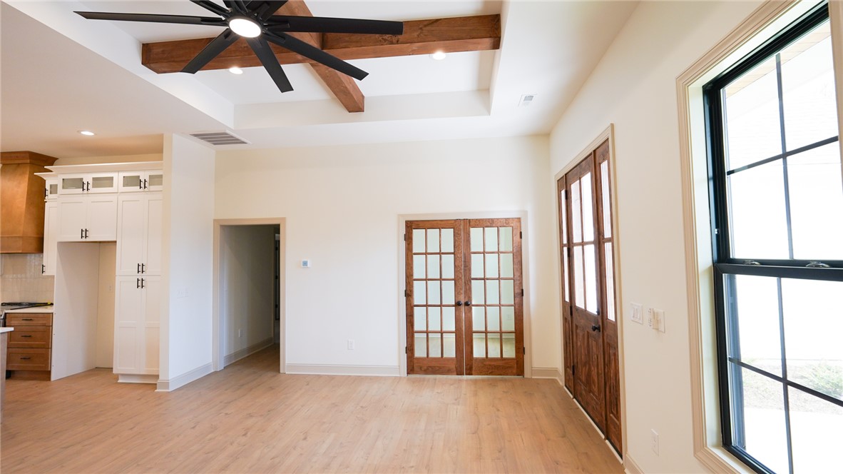 1001 Five Forks Road Pendleton, SC 29670 - Photo 8 of 43 This bright, airy interior features a kitchen with light-colored flooring, leading to a living area with natural light.