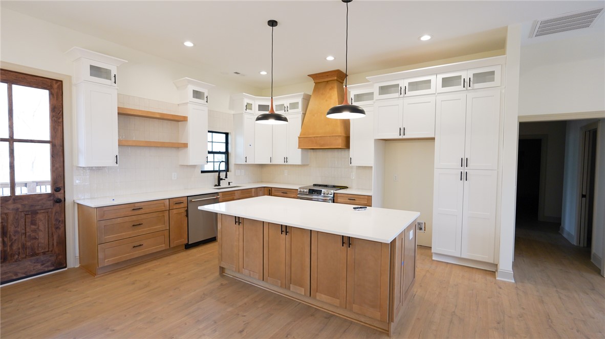 1001 Five Forks Road Pendleton, SC 29670 - Photo 9 of 43 This spacious kitchen offers ample cabinetry, modern fixtures, and a large center island perfect for gathering.